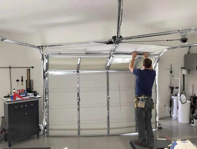 Wallingford Garage Door Repair specialist performing precise section replacement on Wallingford garage door